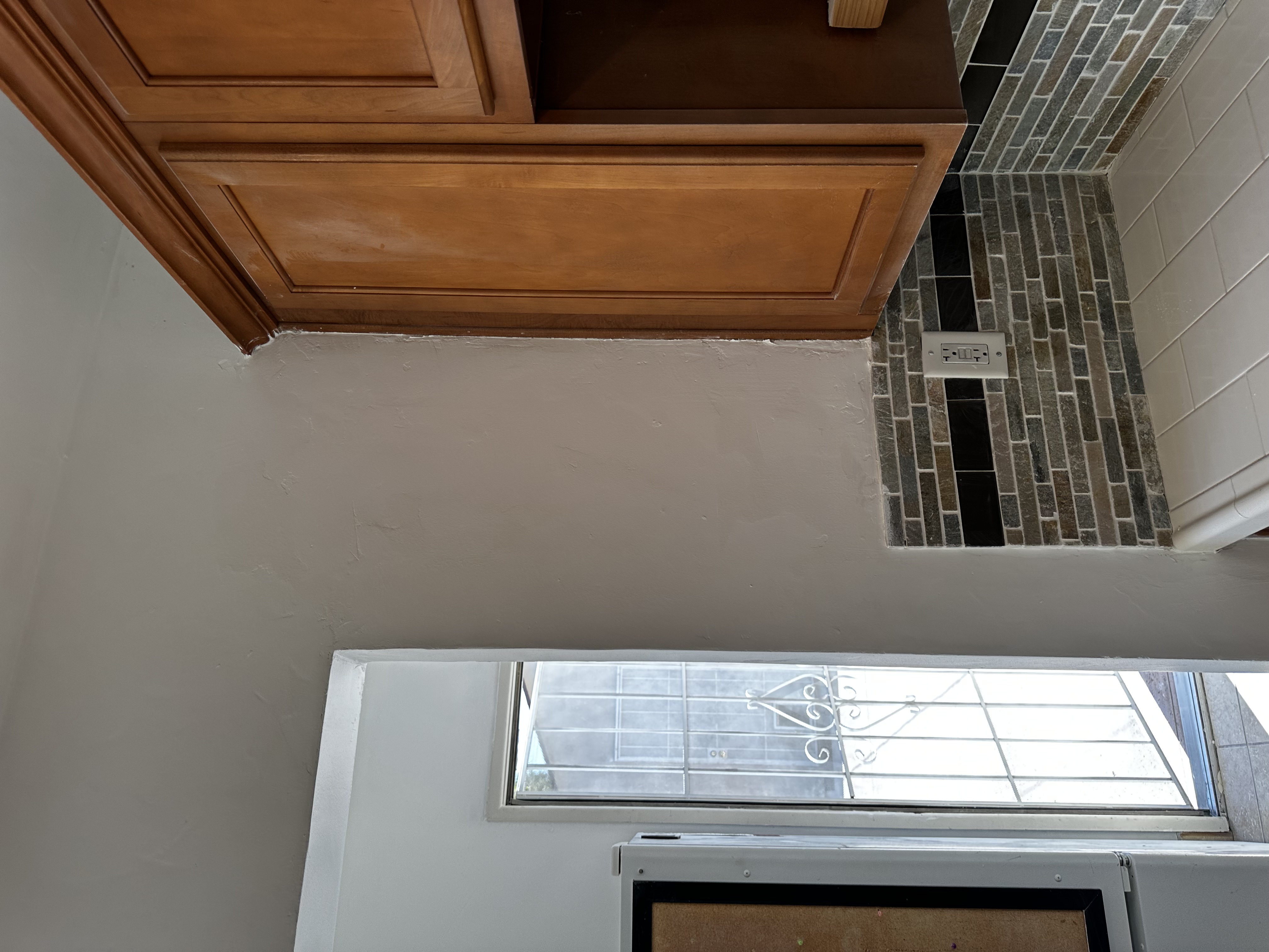 Interior crack repair near cabinets and tile