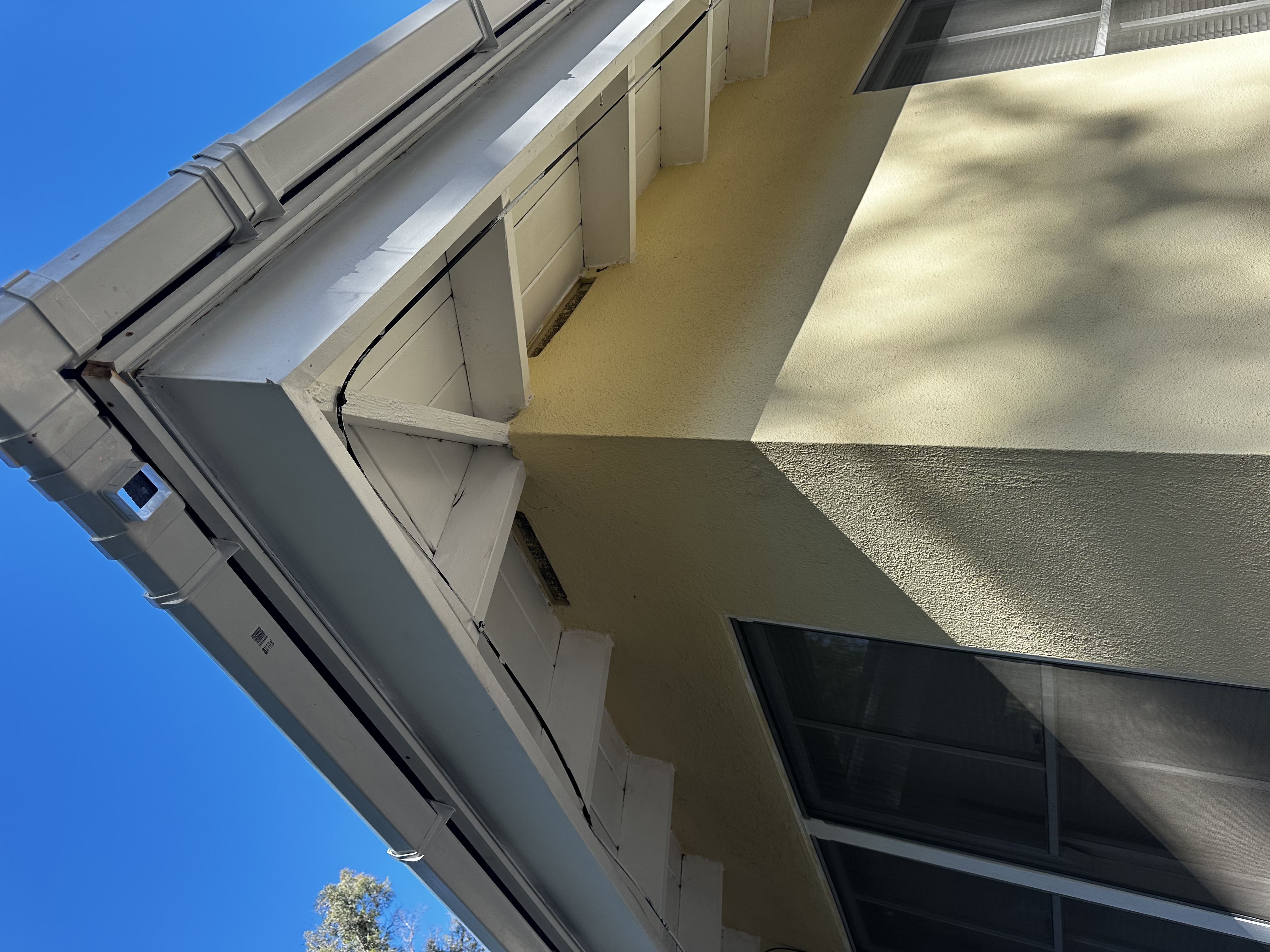 New gutter corner and downspout installation