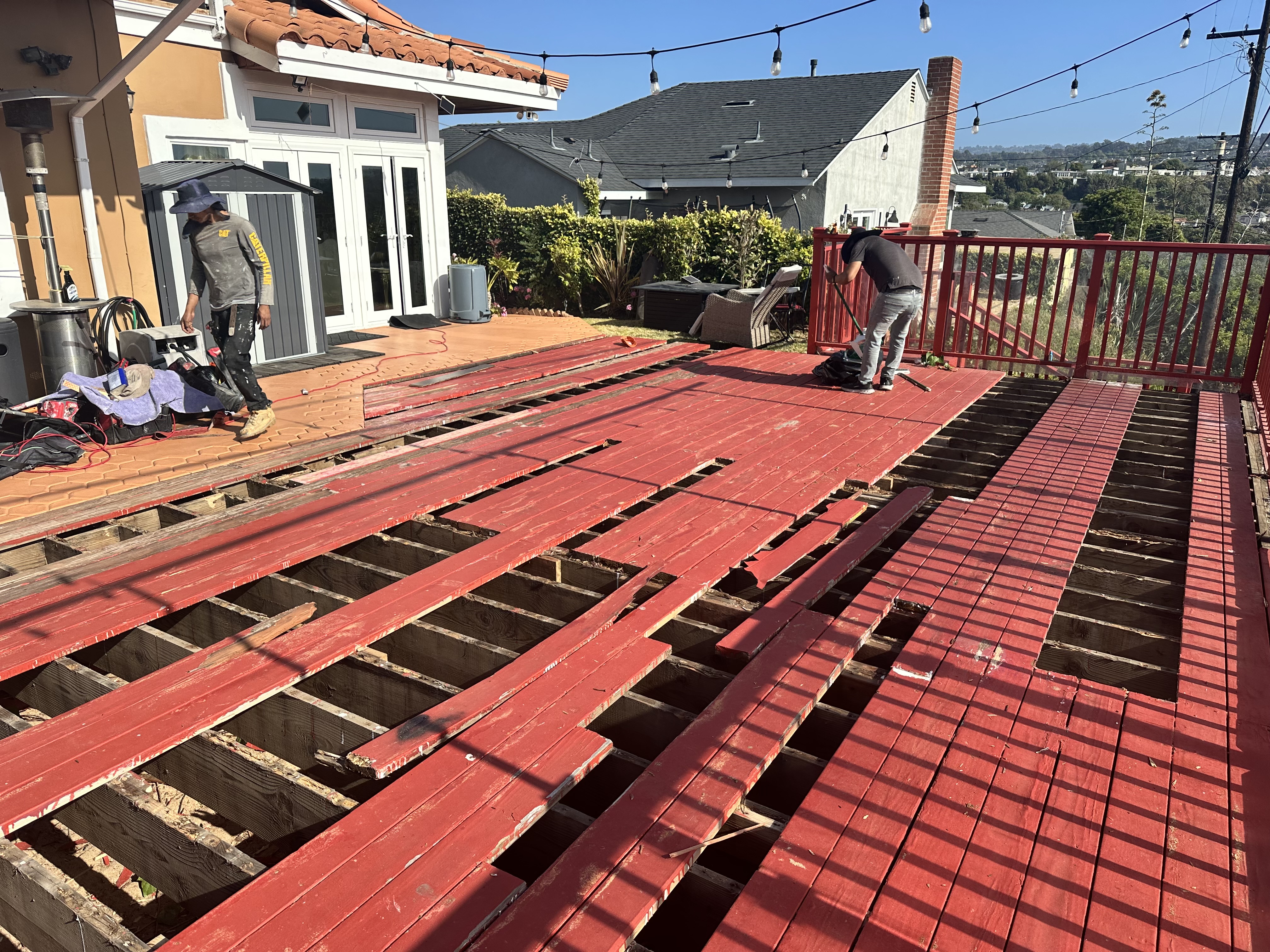 Old rotting, termite-infested deck boards torn out — South Bay home